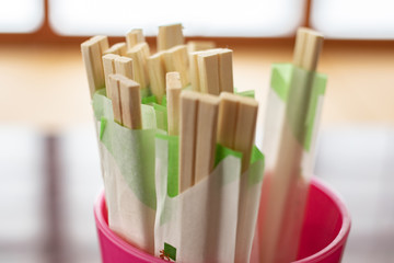 Standing chopstick in a pink cup
