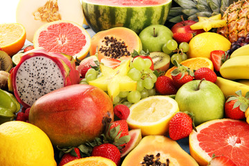 Tropical fruits background, many colorful ripe fresh tropical fruits