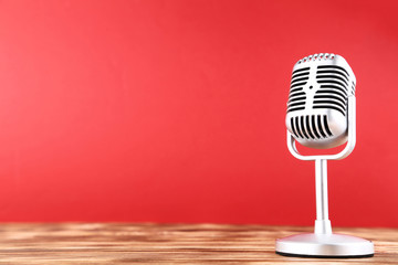 Vintage microphone on red background