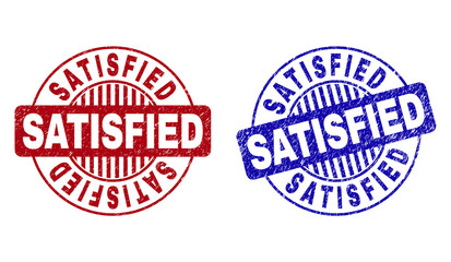 Grunge SATISFIED round stamp seals isolated on a white background. Round seals with grunge texture in red and blue colors. Vector rubber imitation of SATISFIED title inside circle form with stripes.