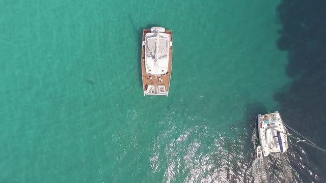 Aerial view of Catamaran boat in turquoise water, South of France.