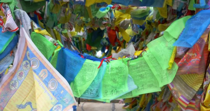 Colorful Tibetan prayer flags swaying in the wind in the temple, Ulan Ude Russia