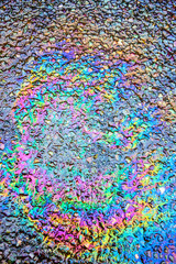 Obraz premium Oil Petrol Pollution Rainbow Spill on A Road