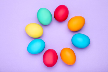 Colorful easter eggs on purple background