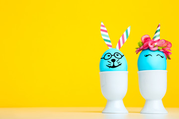 Cute easter eggs on yellow background