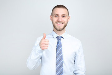Portrait of young man on grey background