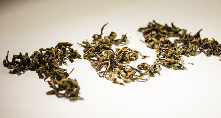 inscription tea from green tea leaves on a white background