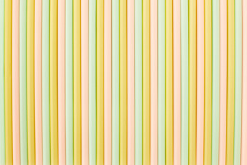 Obraz premium Collection of colorful plastic drinking tubes. Colored tubes for juice and cocktails. Flat lay.