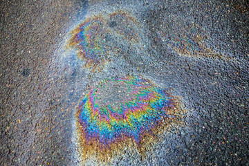 Obraz premium Oil Petrol Pollution Rainbow Spill on A Road