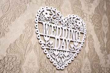 Lettering the wedding day with white wooden letters. Background for the wedding day