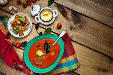 Fototapeta na wymiar Gaspacho (tomatoes soup) and ingredients.