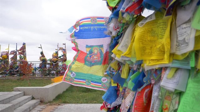 Colorful Tibetan prayer flags swaying in the wind in the temple, Ulan Ude Russia