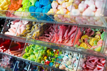 Variety of colored sweets on shelves