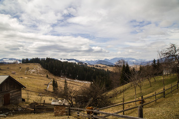 Fototapeta premium Snowy tops of the mountains are still in spring