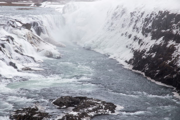 Amazing Icelandic winter landscape of majestic waterfall of frozen Gullfoss