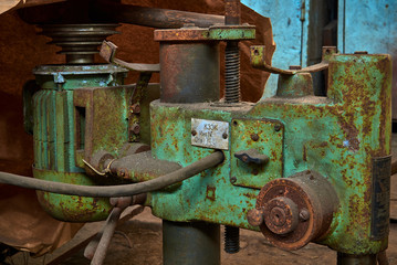 old rusty dirty machines and mechanisms in an abandoned factory
