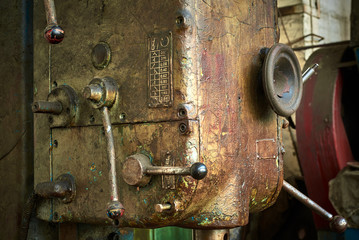 old rusty dirty machines and mechanisms in an abandoned factory