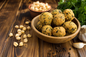 Chickpea falafel in the brown bowl on the wooden  background