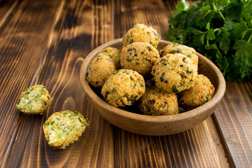 Chickpea falafel in the brown bowl on the wooden  background