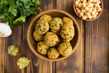 Chickpea falafel in the brown bowl on the wooden  background.Top view.Copy space.