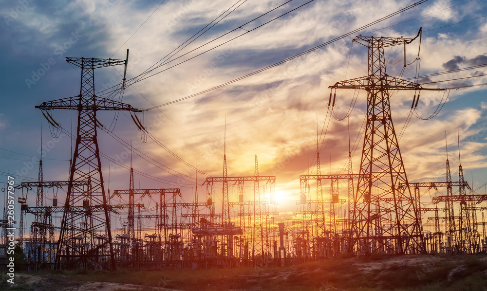 Wall mural electrical substation silhouette on the dramatic sunset background