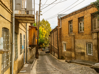 Old town. Street of the old town. Ancient buildings and brick houses, cobblestones. Street perspective. Tbilisi. Georgia