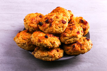 Baked cottage cheese and oatmeal cookies with raisins. Healthy nutrition, diet food.