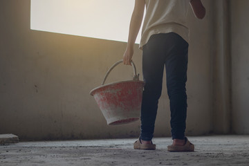 Child labor in building commercial building structures. World Labor Day concept