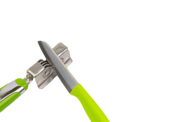 Knife, kitchen tools and knife sharpener isolated on white background. Selective focus and crop fragment