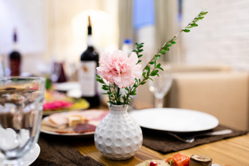 Wedding table in a restaurant with flower composition
