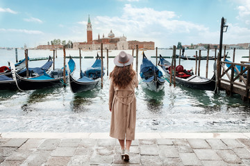 Fototapeta na wymiar Woman on a background of water in Venice