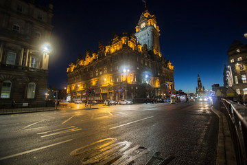 Fototapeta na wymiar The Balmoral Hotel by night, a historic building in Edinburgh