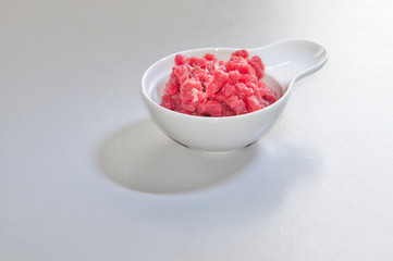 Ingredients for a healthy dish. Hacked ham in a small ceramic bowl.