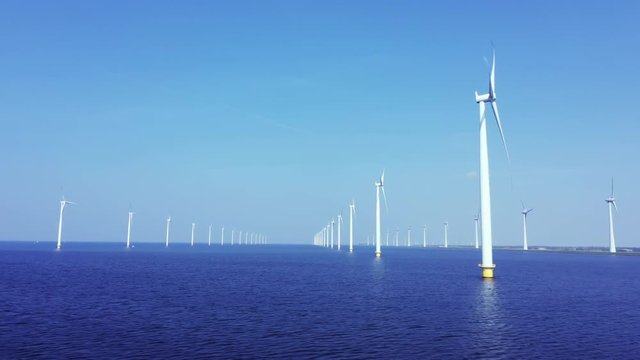 WindTurbines in a blue sea on a sunny day 