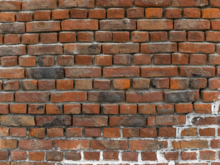 Mur de briques multicolores rouges orangées