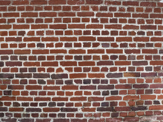 Mur de briques multicolores rouges orangées