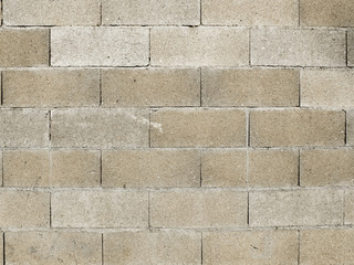 Mur de briques en parpaing gris de forme réctangulaires
