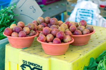 plums at farmers market