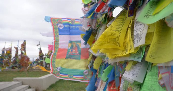 Colorful Tibetan prayer flags swaying in the wind in the temple, Ulan Ude Russia