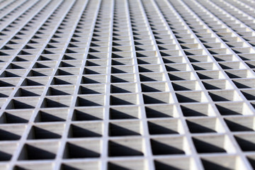 metal lattice in the sun close-up
