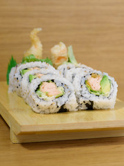 maki roll with shrimps fried, avocado and lattuce