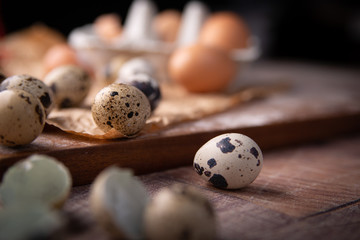 Quail eggs in paper on the kitchen table.