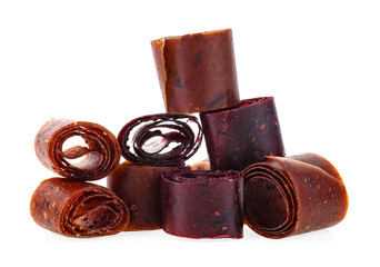 Delicious healthy fruit roll-ups isolated on a white background. Fruit pastille slices.