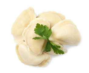 Tasty boiled dumplings with parsley on white background, top view