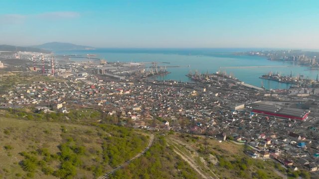 4k footage of the bay in Novorossiysk city. shooting from drone, camera movement backward. Shooting the city from a height