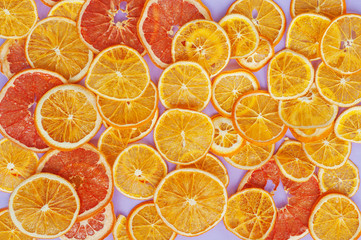 Dried orange slices chips background. Dehydrated crispy fruit slices Healthy meal snack Top view, flat lay. Isolated. Texture.
