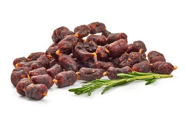 Dry sausages from game with rosemary, close-up, isolated on white background