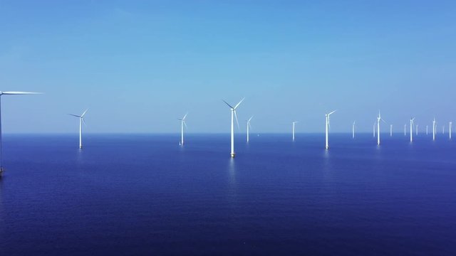 WindTurbines in a blue sea on a sunny day 