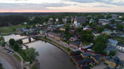 Beautiful aerial city landscape with idyllic river and old buildings at summer evening in Porvoo, Finland.