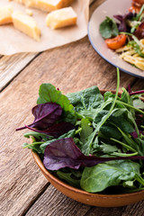 Fresh salad in ceramic bowl, healthy plant-based meal